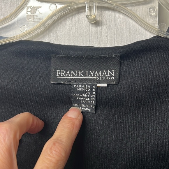 Frank Lyman brand black and silver 3/4 sleeve ruffle top with v neck. - Picture 2 of 4